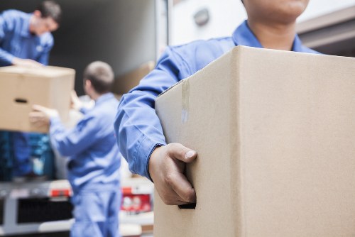 Customer placing goods into a storage unit at Chasecross Storage