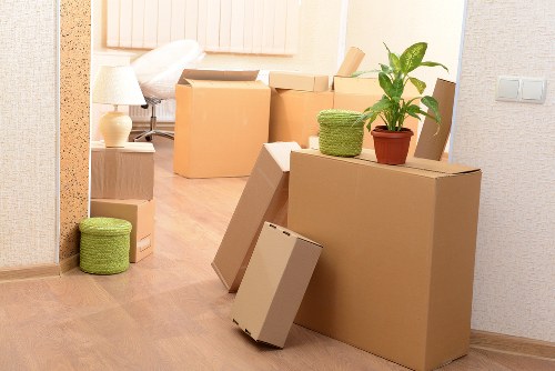 Professional movers handling furniture in a Chasecross apartment